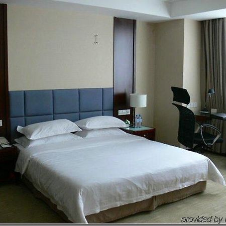 New Land Business Hotel Wuhan Room photo